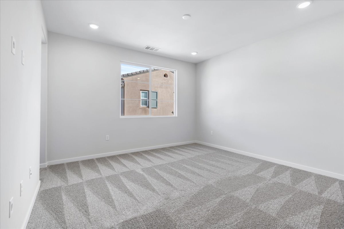 A room with a window and a tile floor.