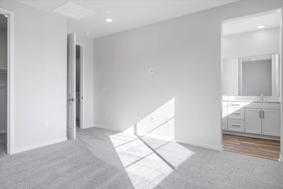 A modern bathroom with white walls.