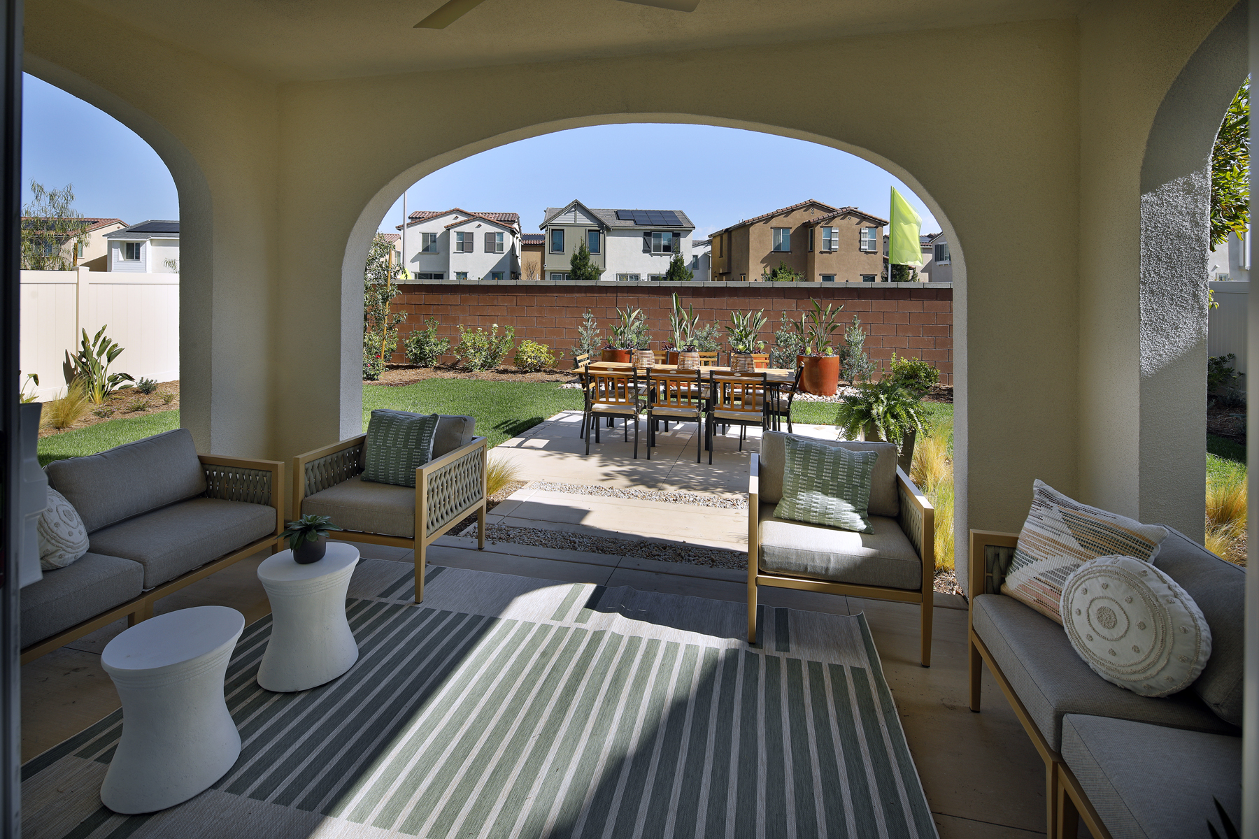 A patio with a table and chairs.