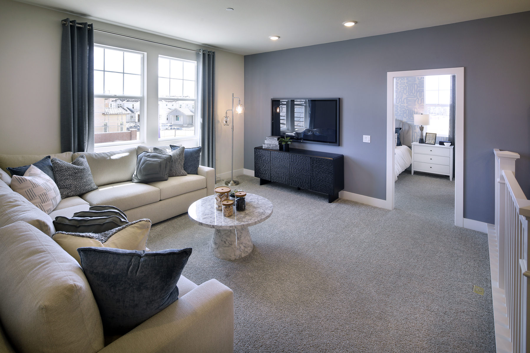 A living room with a tv and couches.