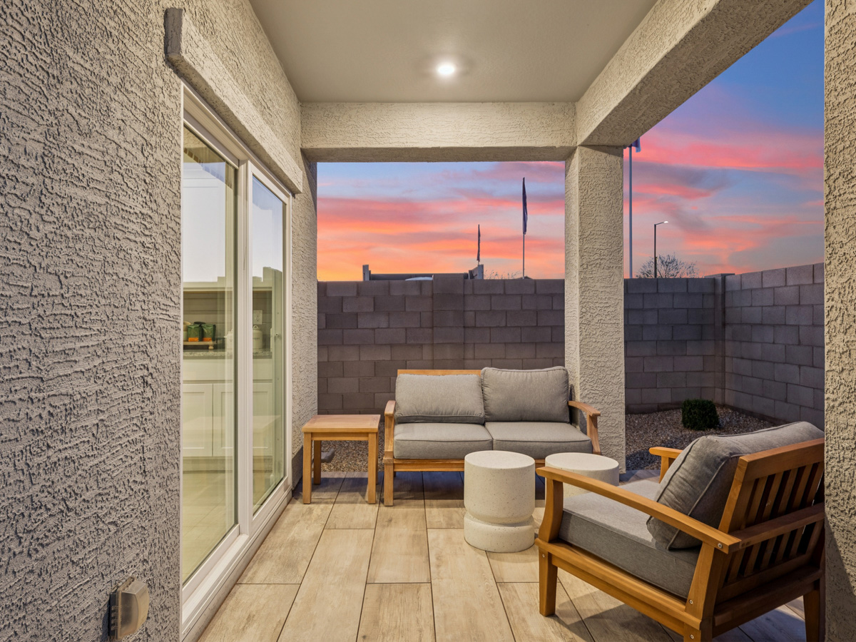 A room with a couch and a chair.