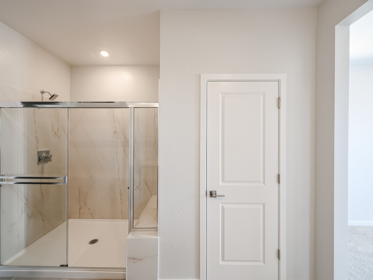 A bathroom with a glass shower.