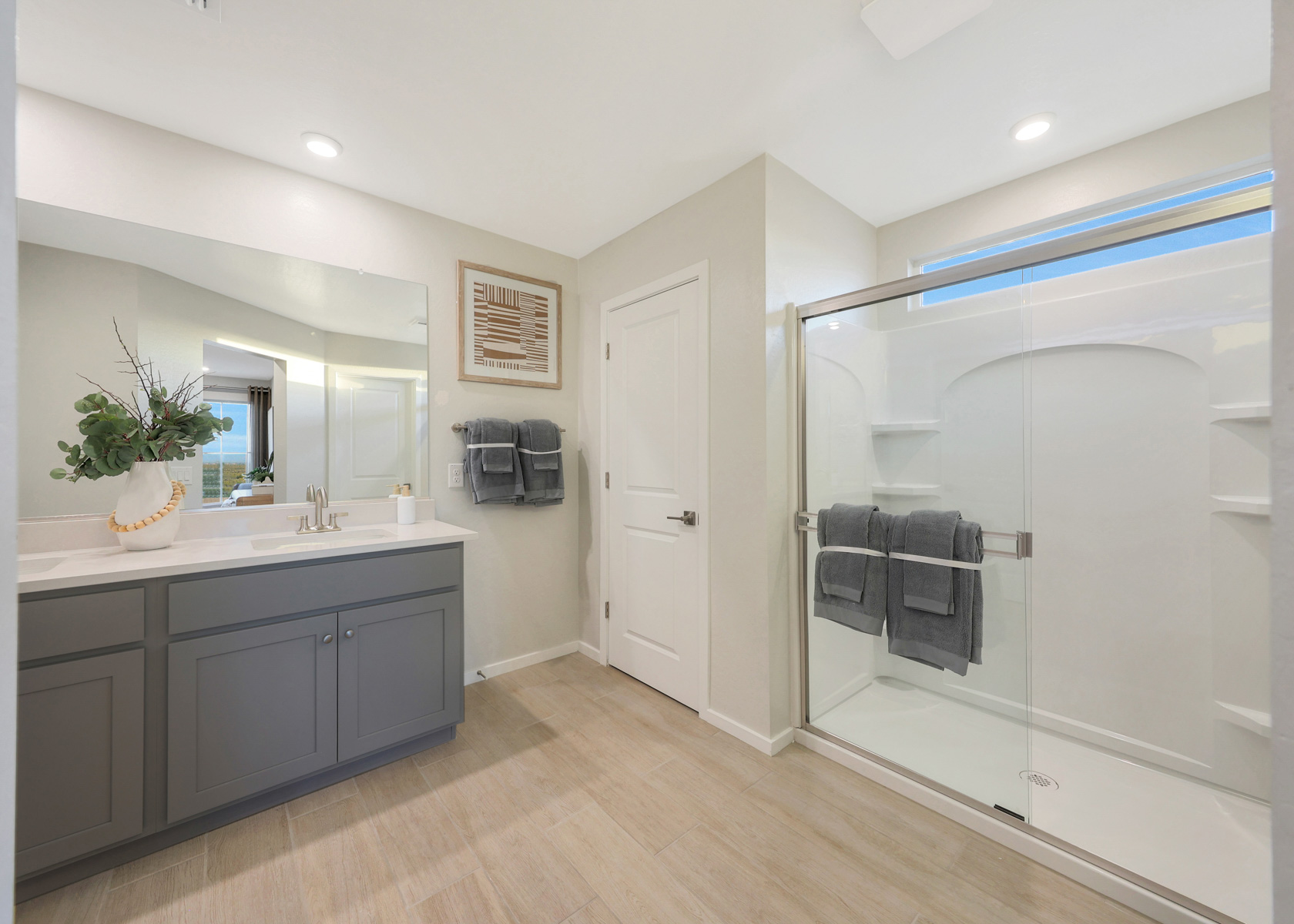 A bathroom with a glass shower.