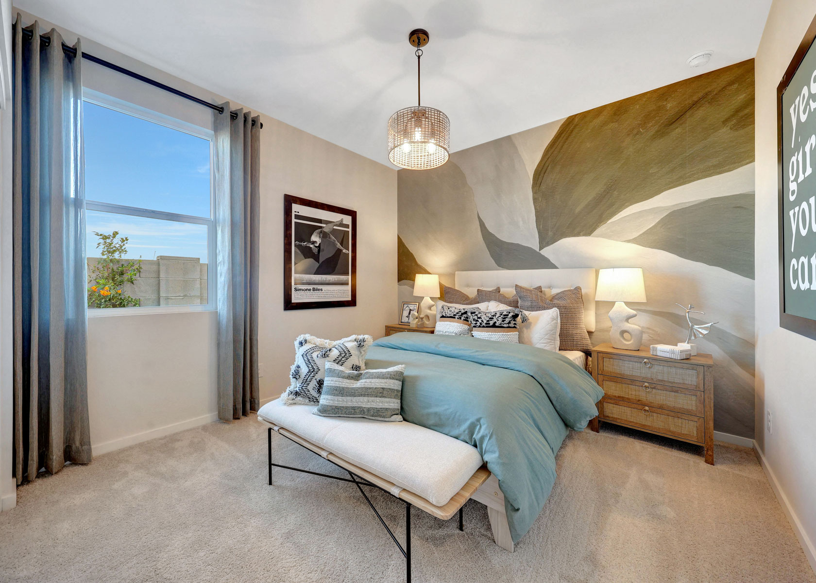 A bedroom with a bed and a window.