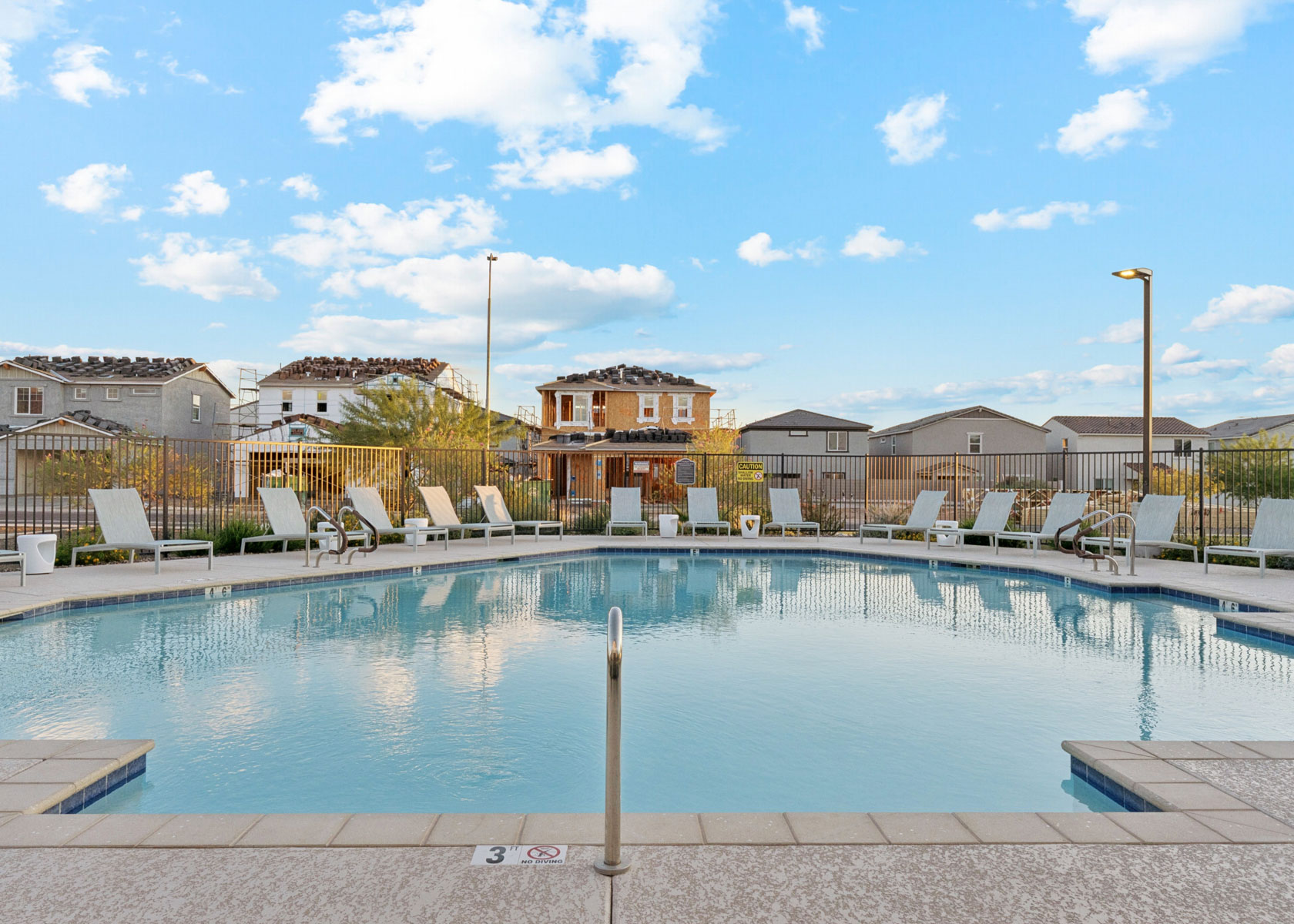 A pool with a fence around it.