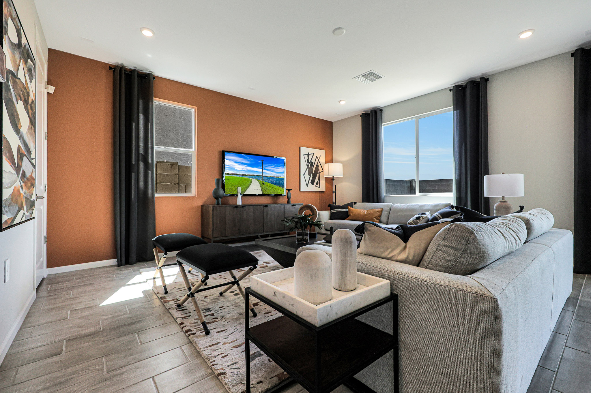 A living room with a large tv.