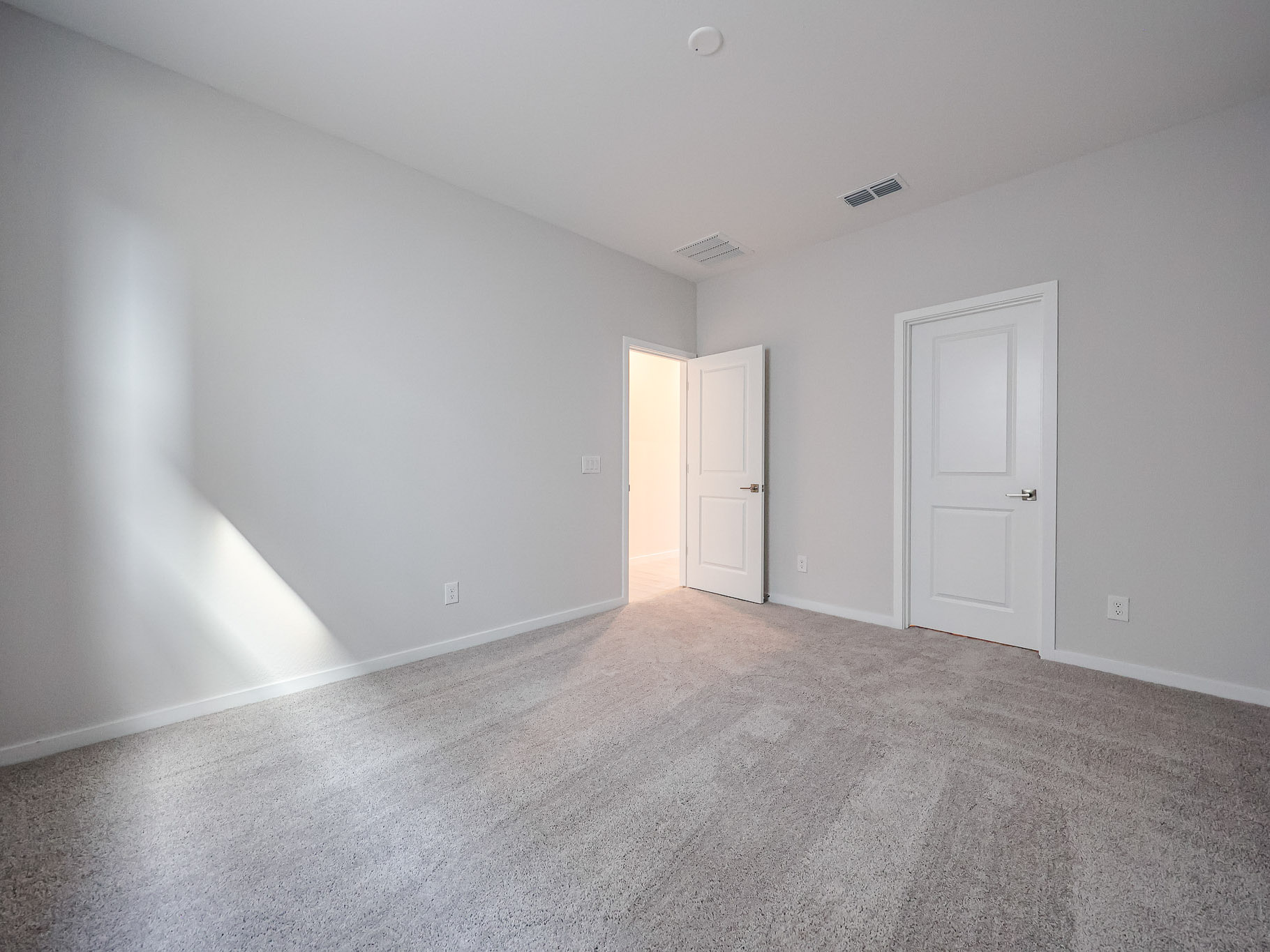 A room with white doors.