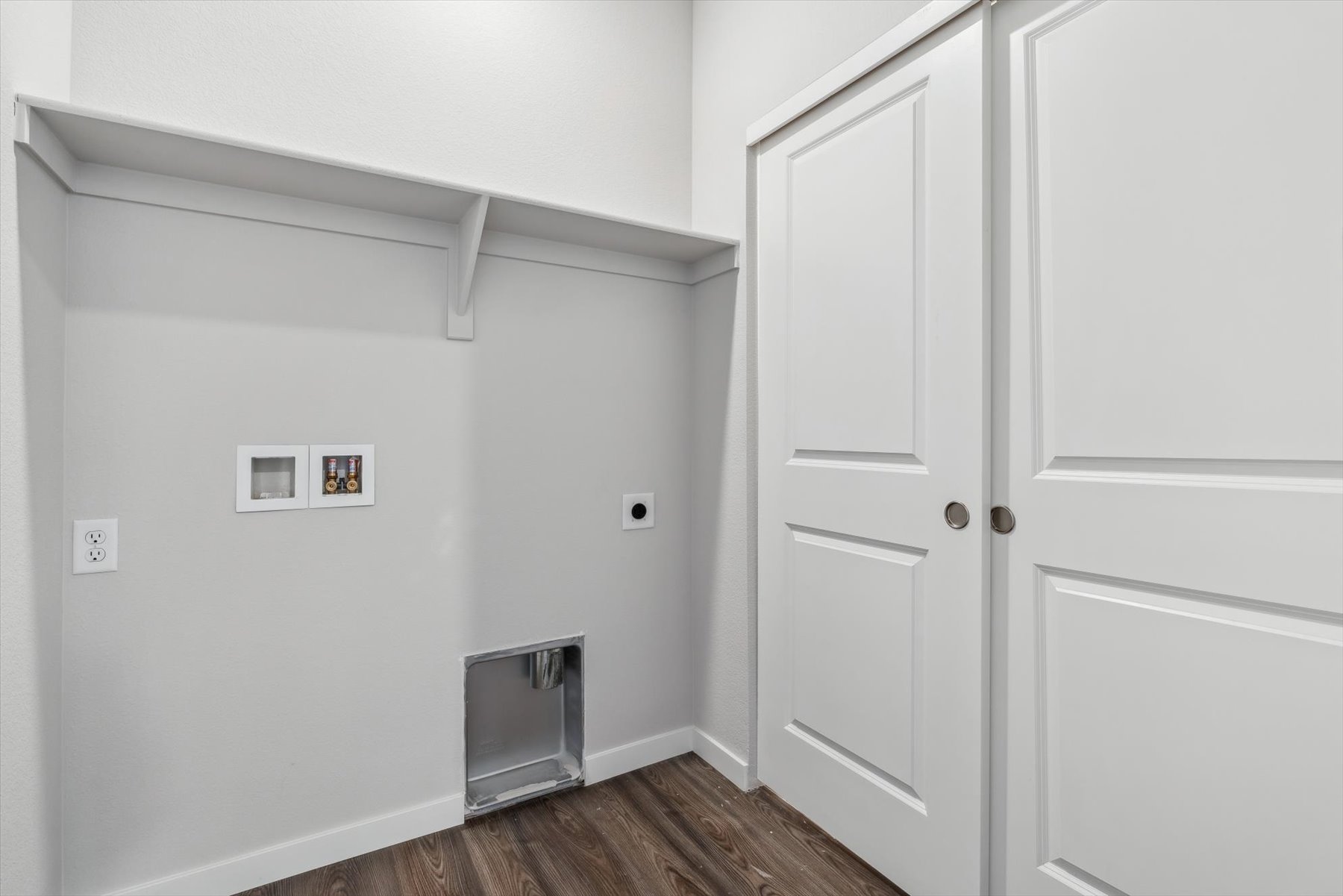 A room with white cabinets.