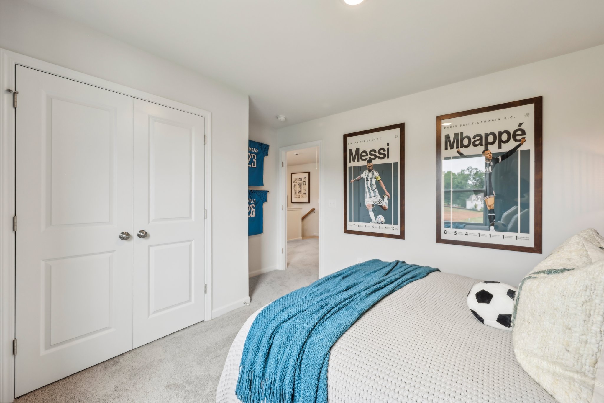 A room with a bed and a pillow.