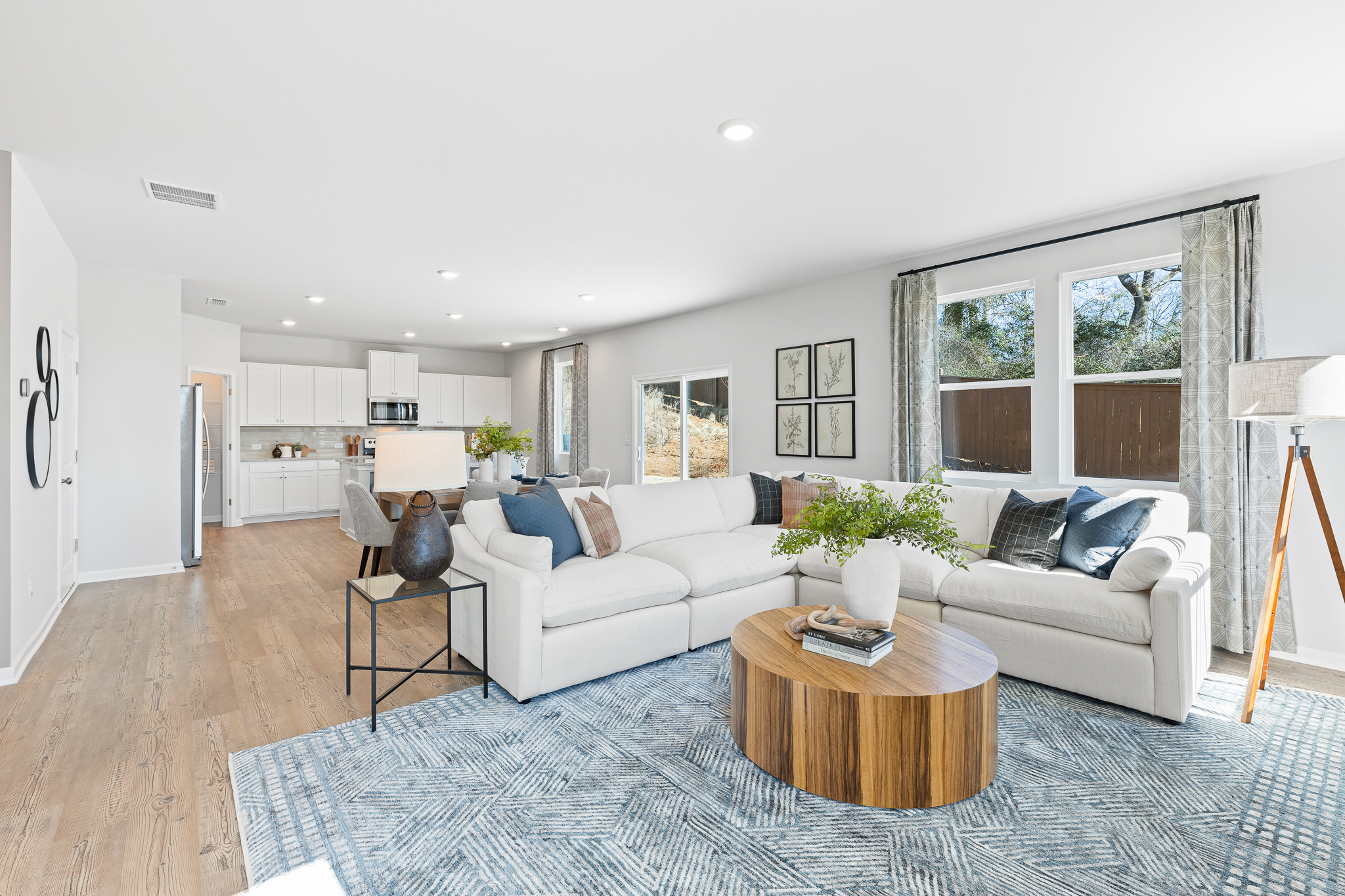 A living room with a rug and a table.
