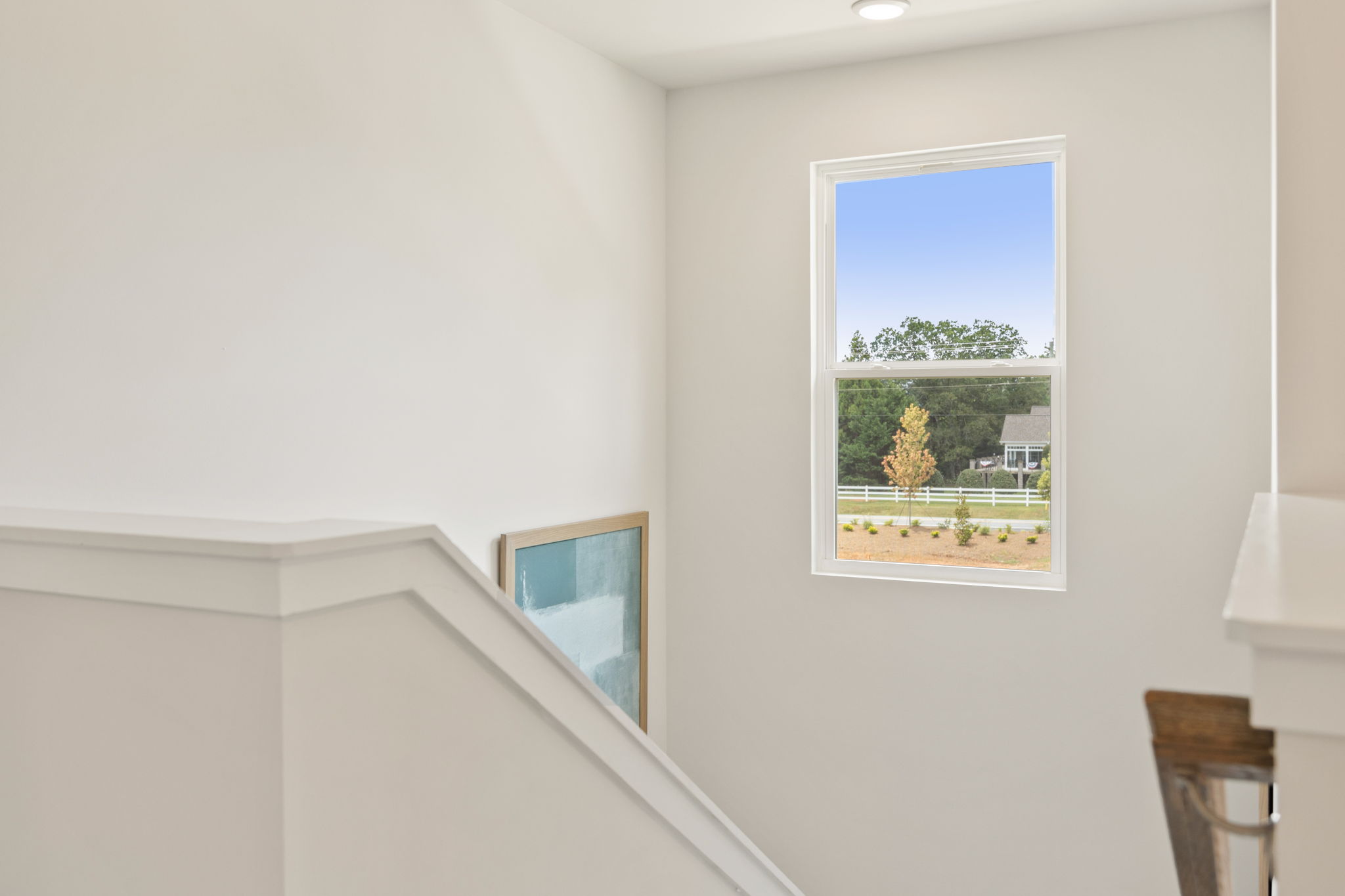 A couple of windows in a room.