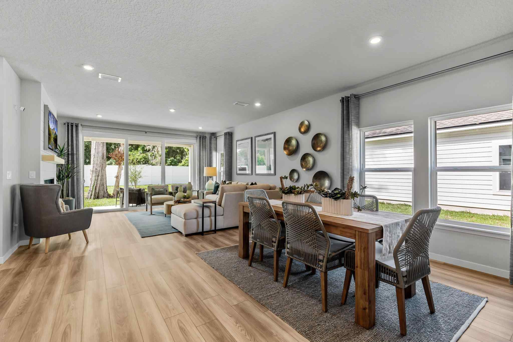 A large dining room with a large table and chairs.