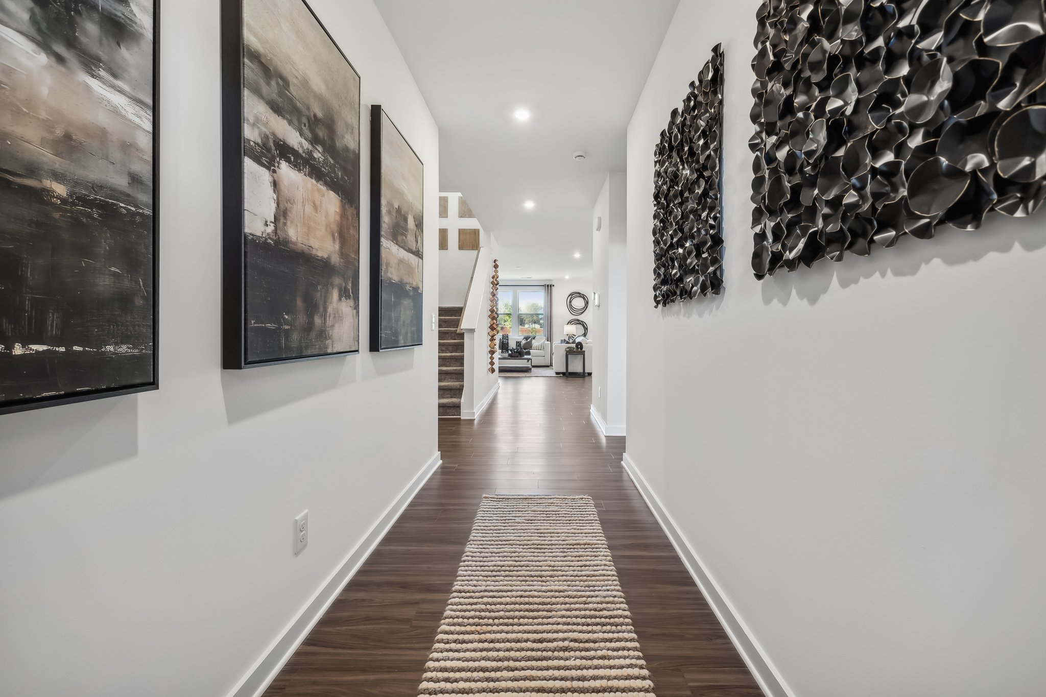 A hallway with art on the walls.