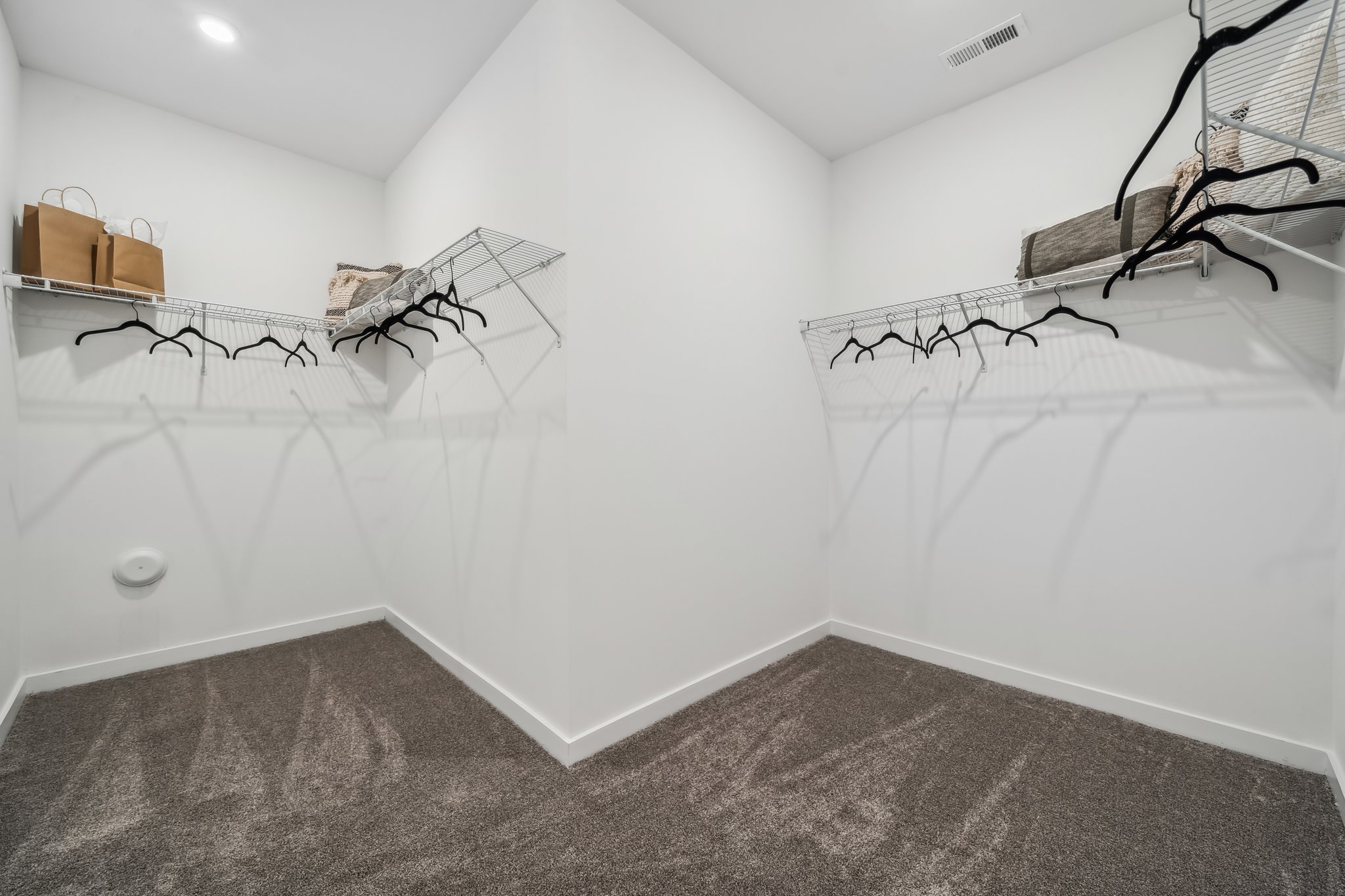 A white room with a staircase.