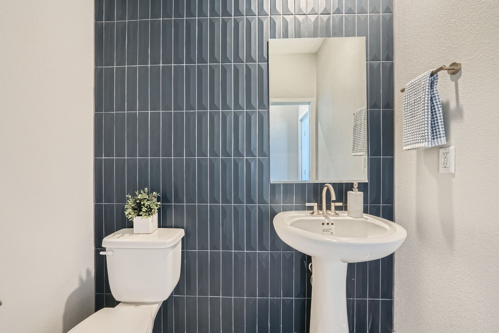 A bathroom with a sink and toilet.