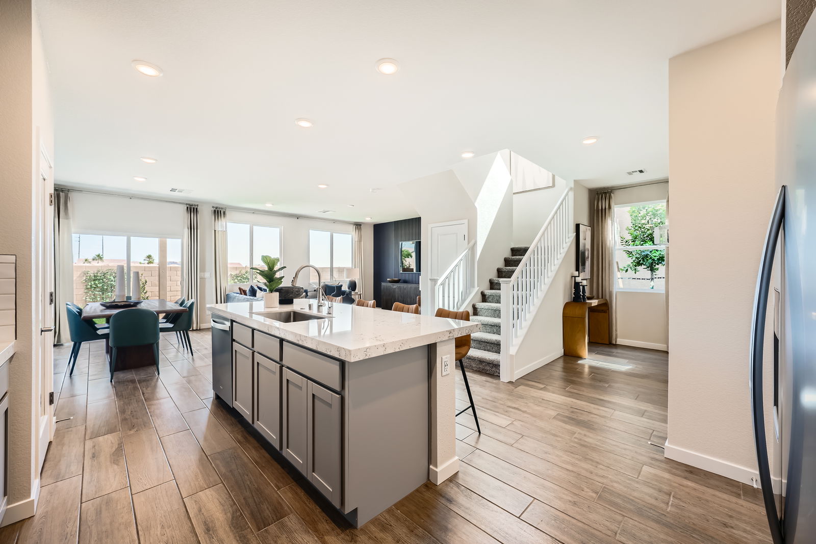 A kitchen with a wood floor.