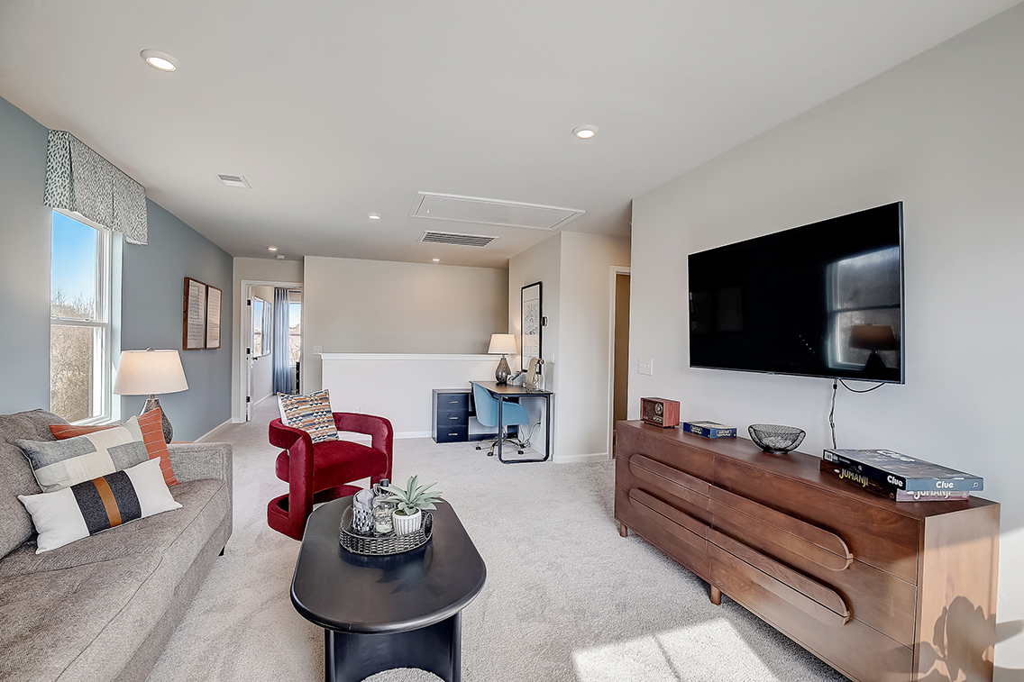A living room with a tv and couches.