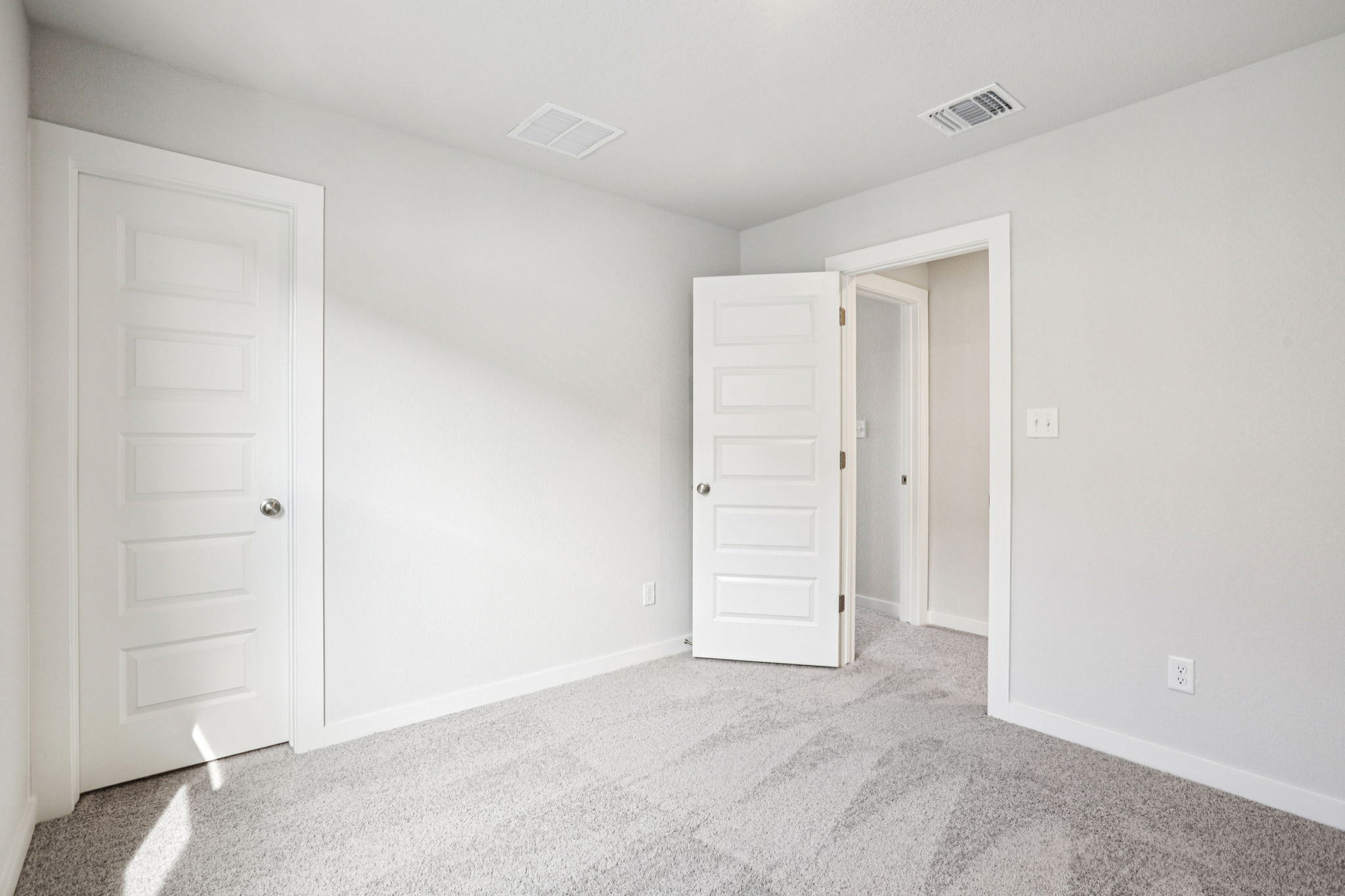 A room with white doors.