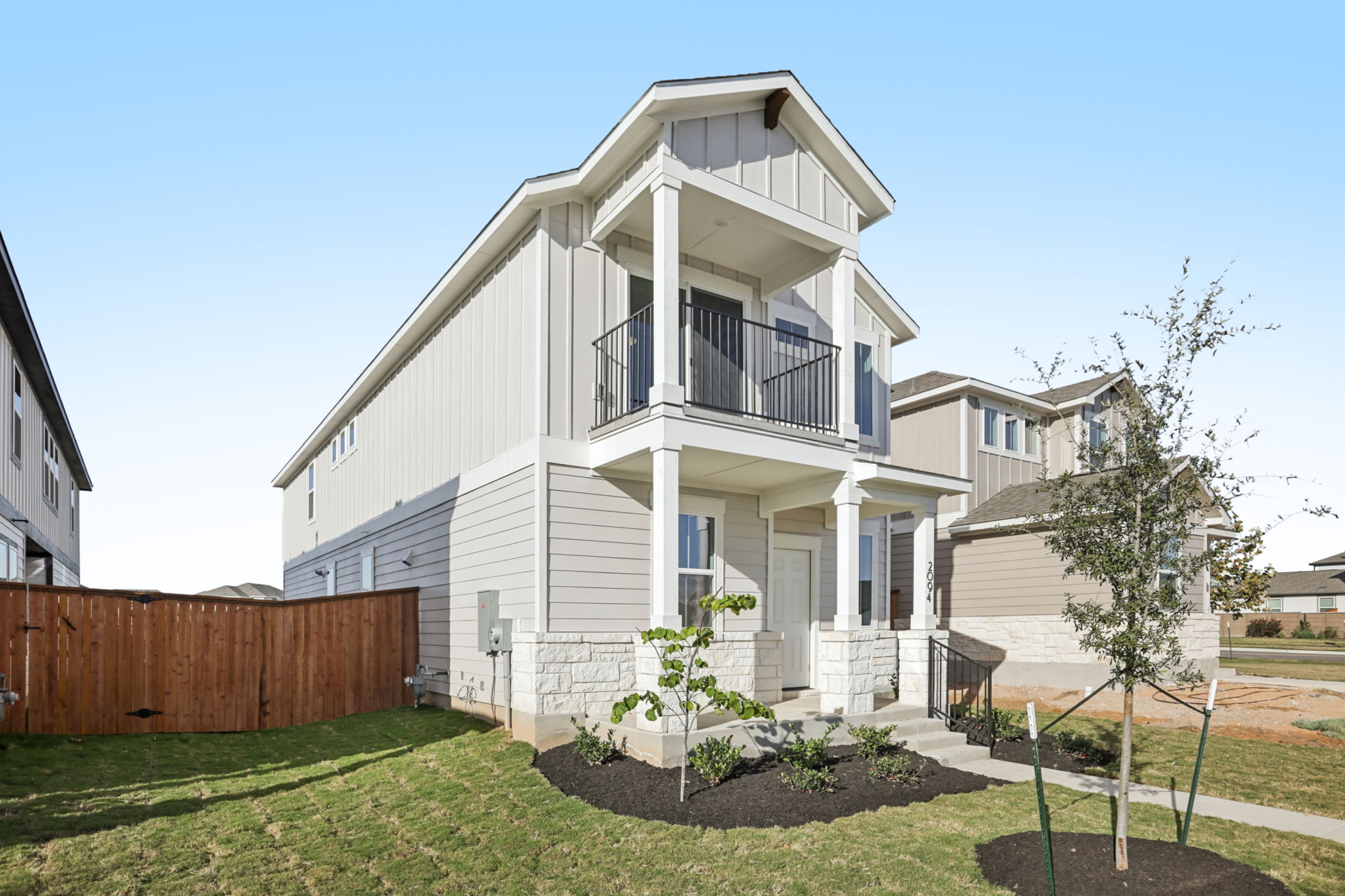 A white house with a fence.