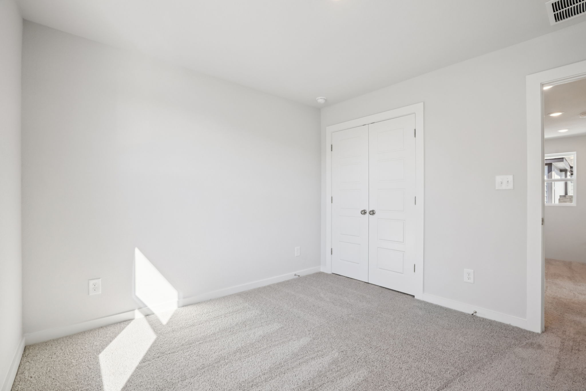 A room with white doors.