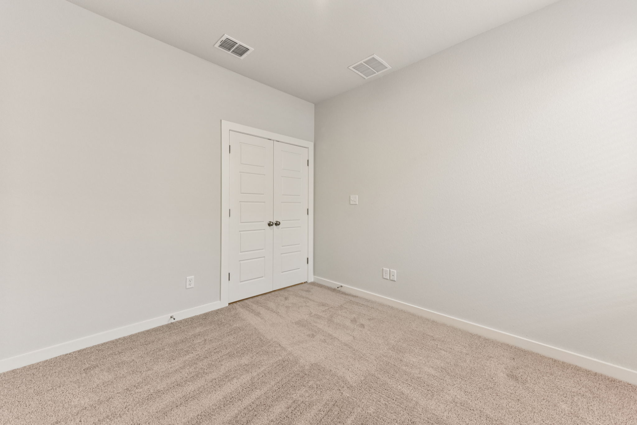 A room with white doors.