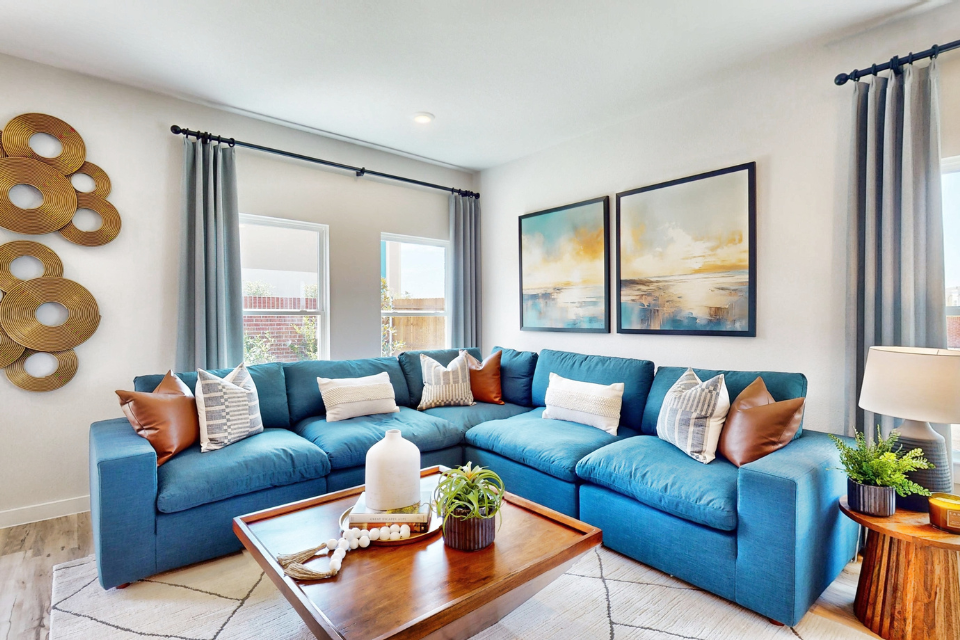 A blue couch in a room.