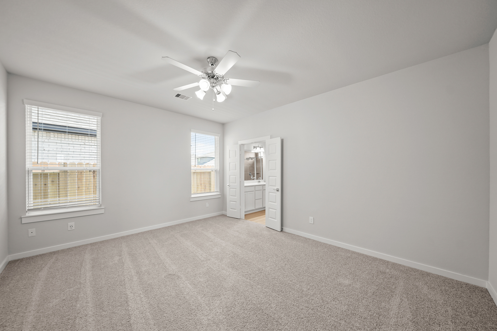 A living room with a ceiling fan.