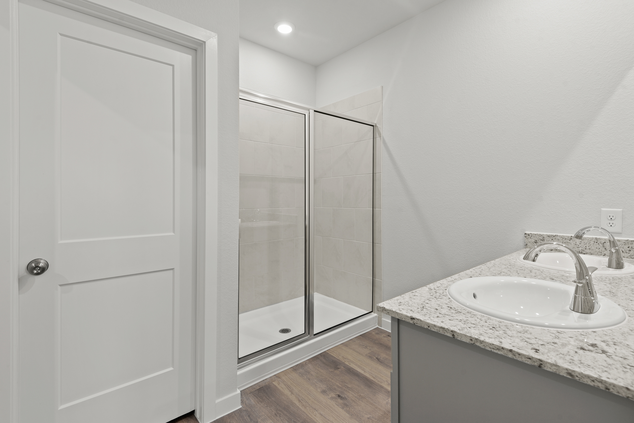 A bathroom with a glass shower.