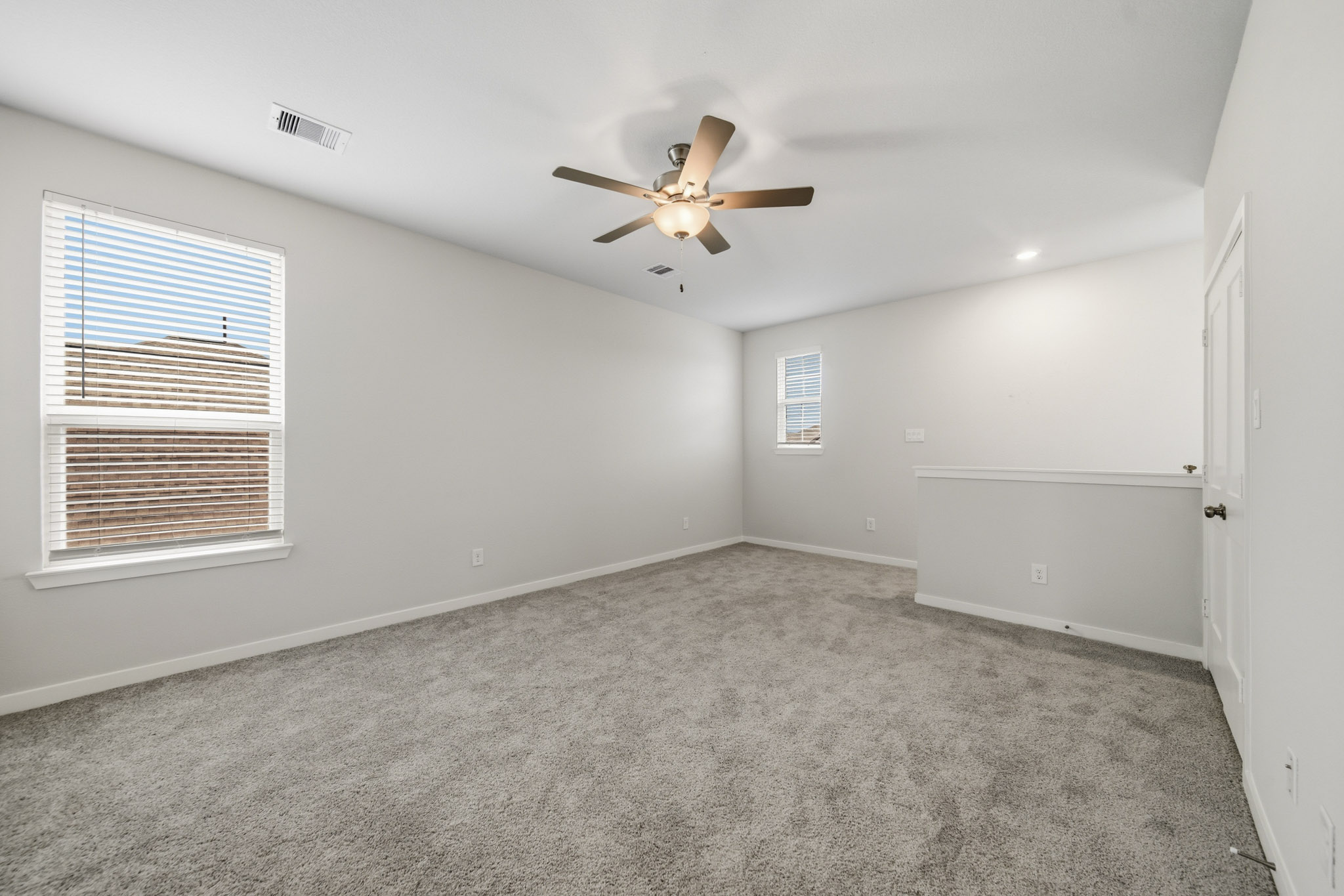 A ceiling fan in a room.