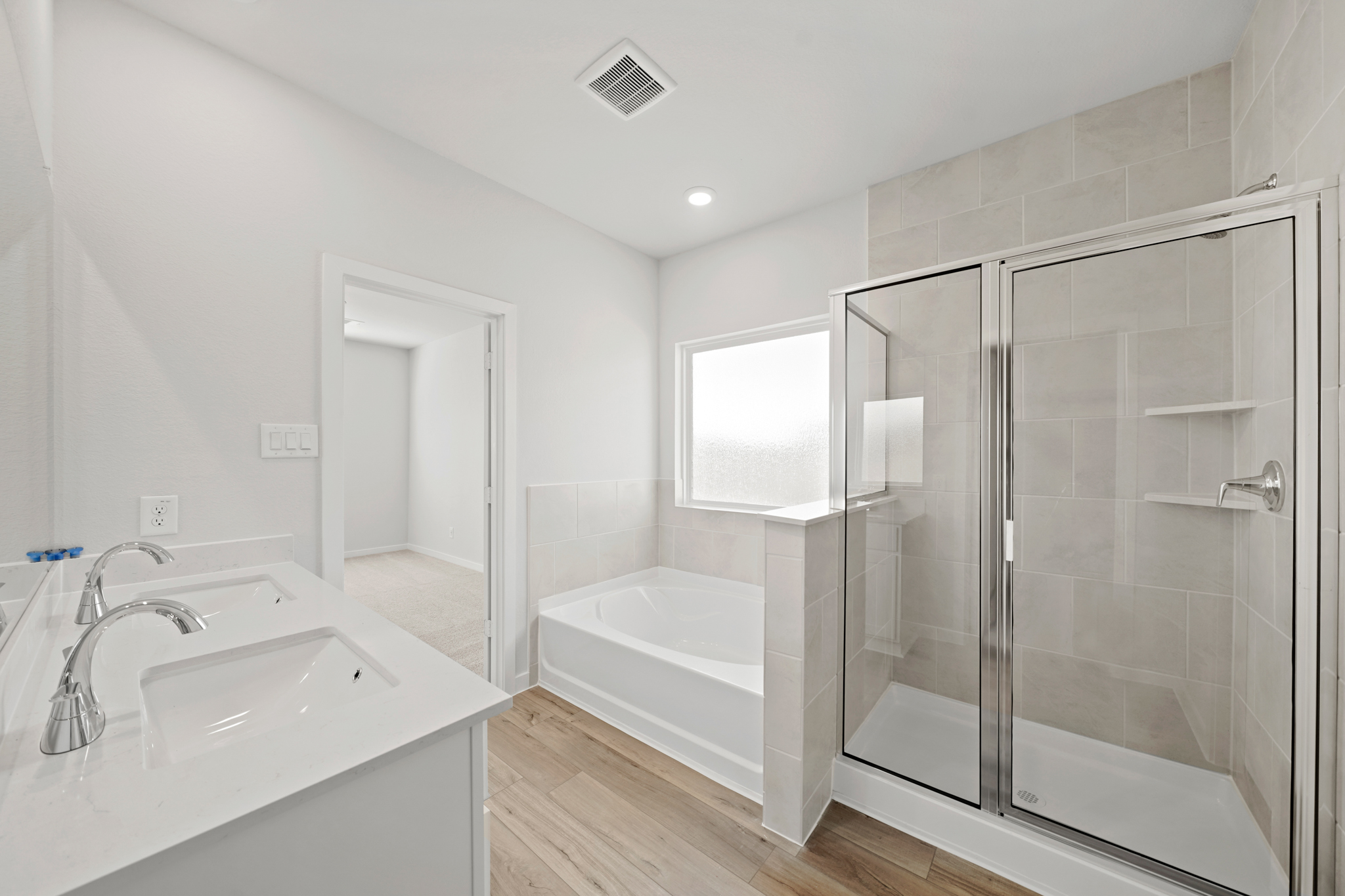 A bathroom with a glass shower.