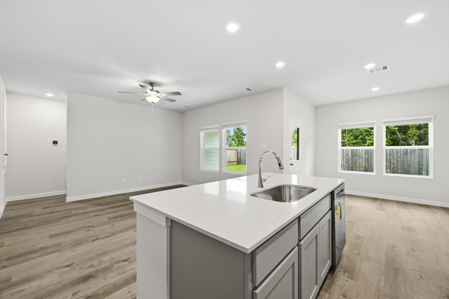 A kitchen with a sink and a counter top.
