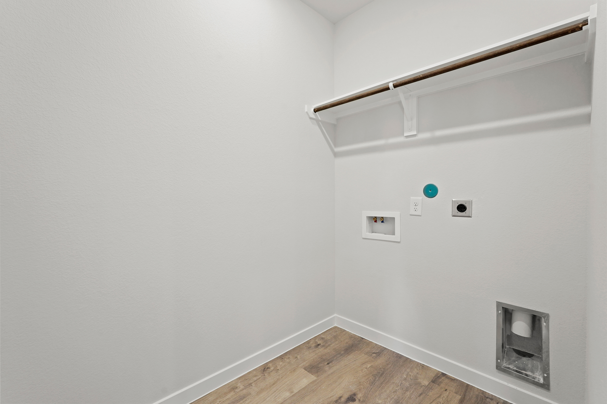 A white wall with a light on it.