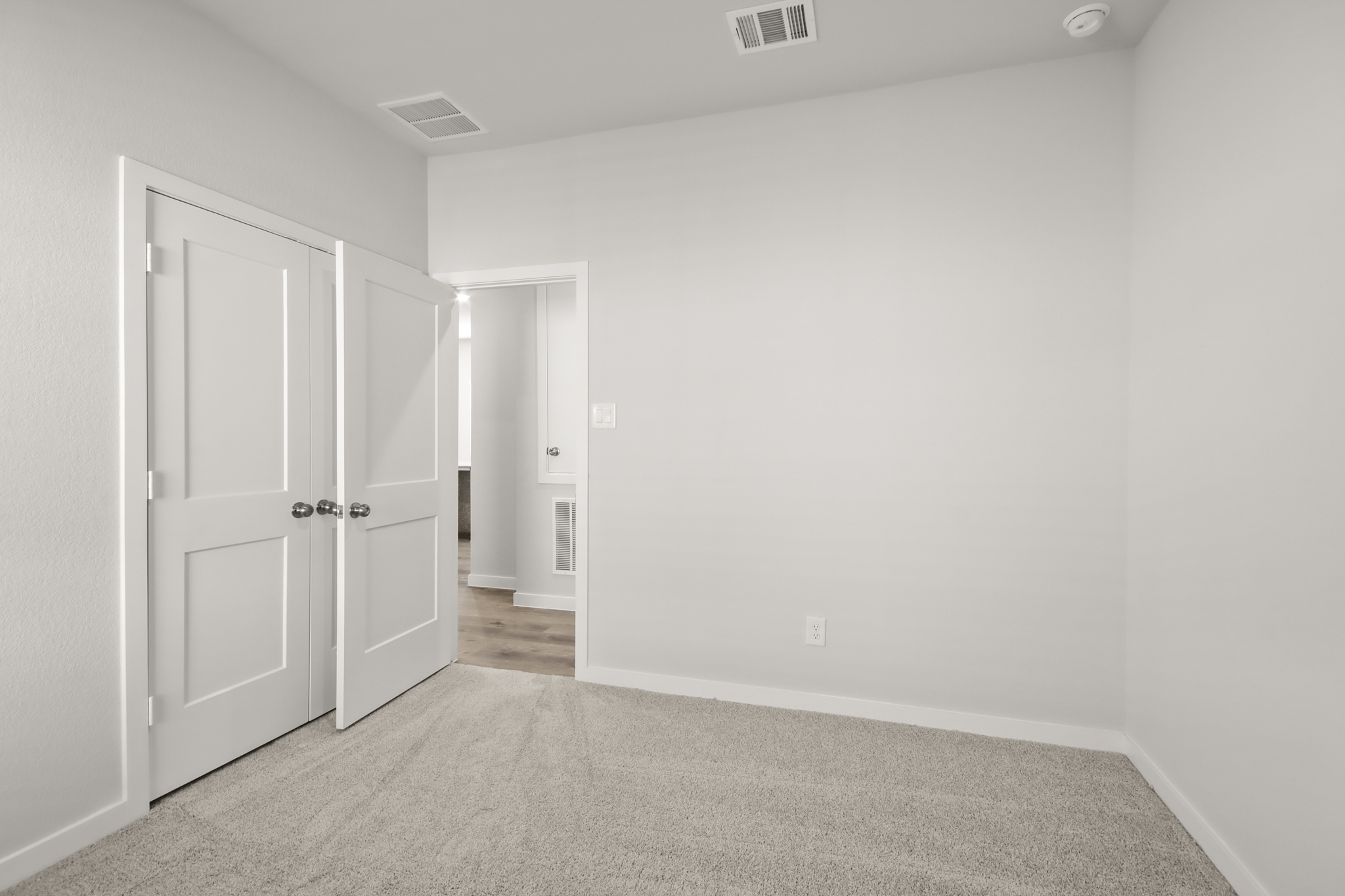 A room with white doors.