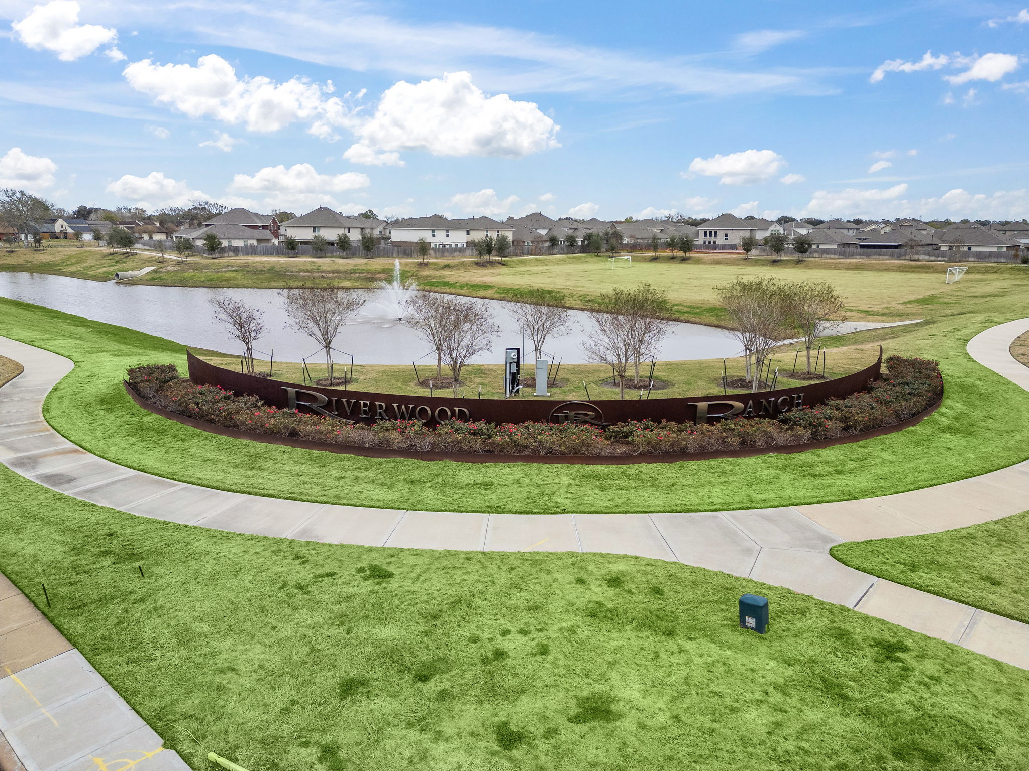 A pond with a fountain in it.