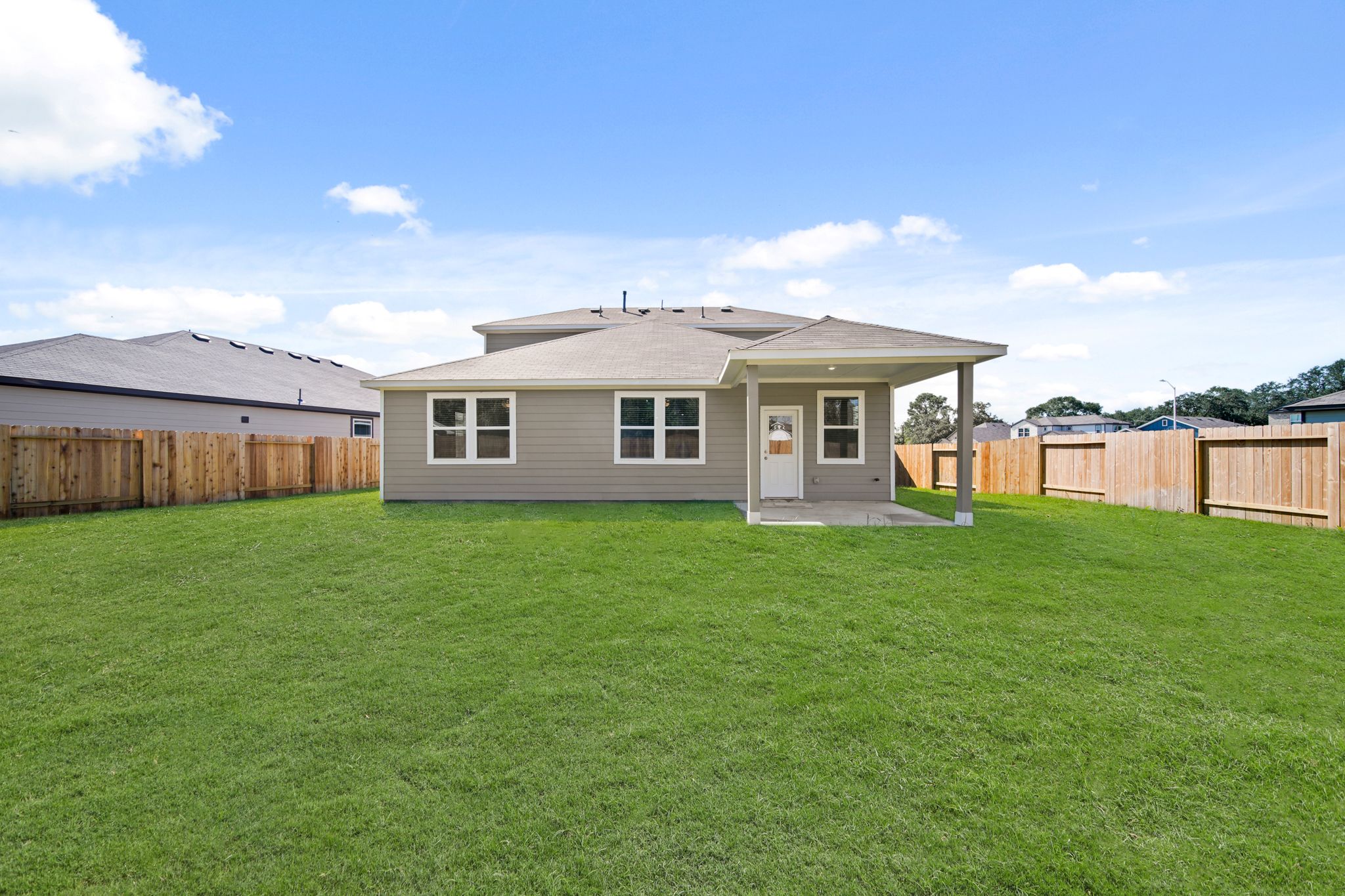 A house with a fence around it.