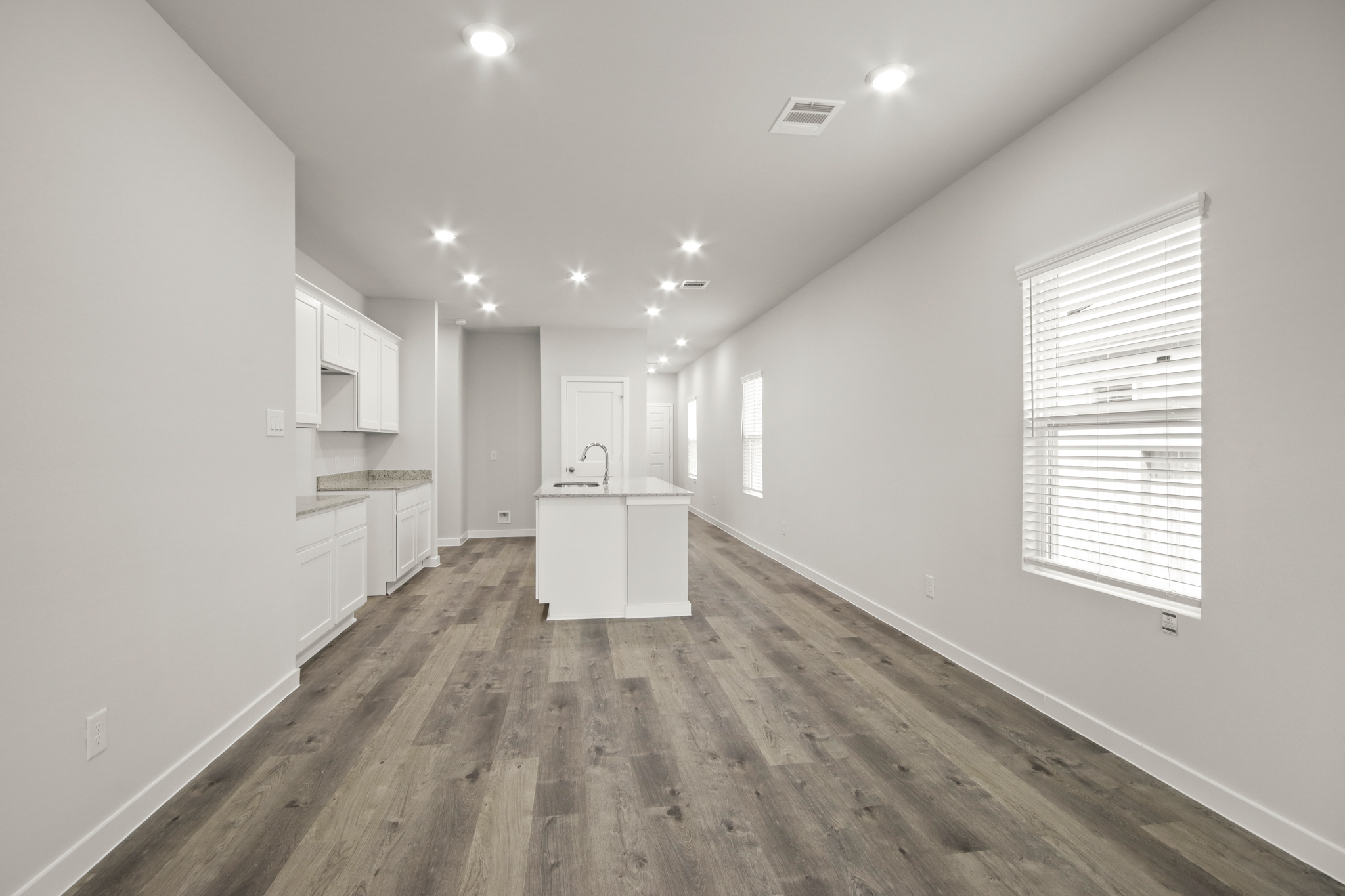 A room with white cabinets.