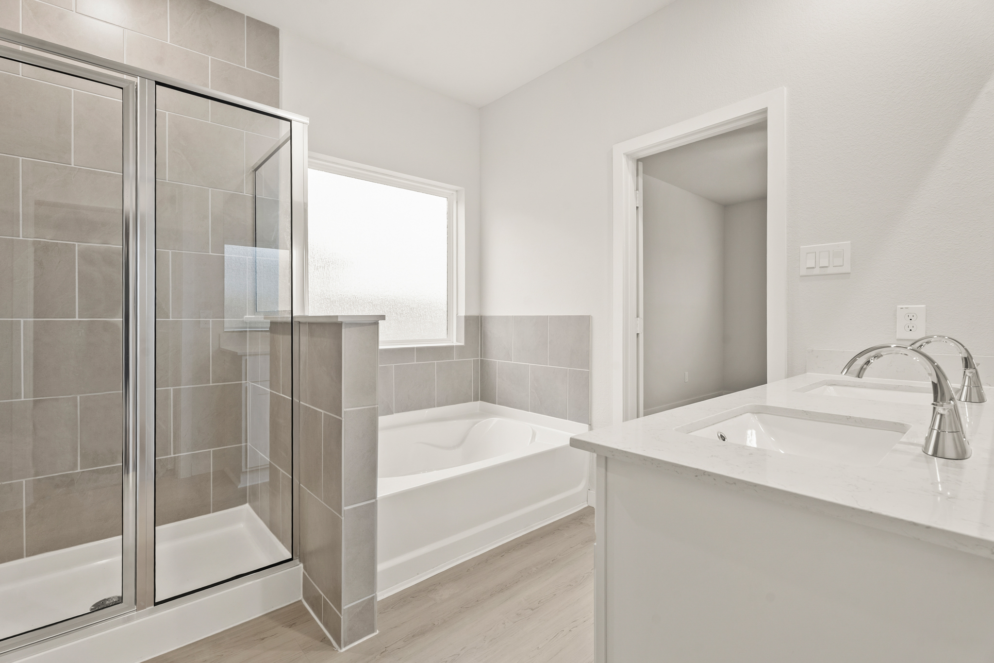 A bathroom with a glass shower.