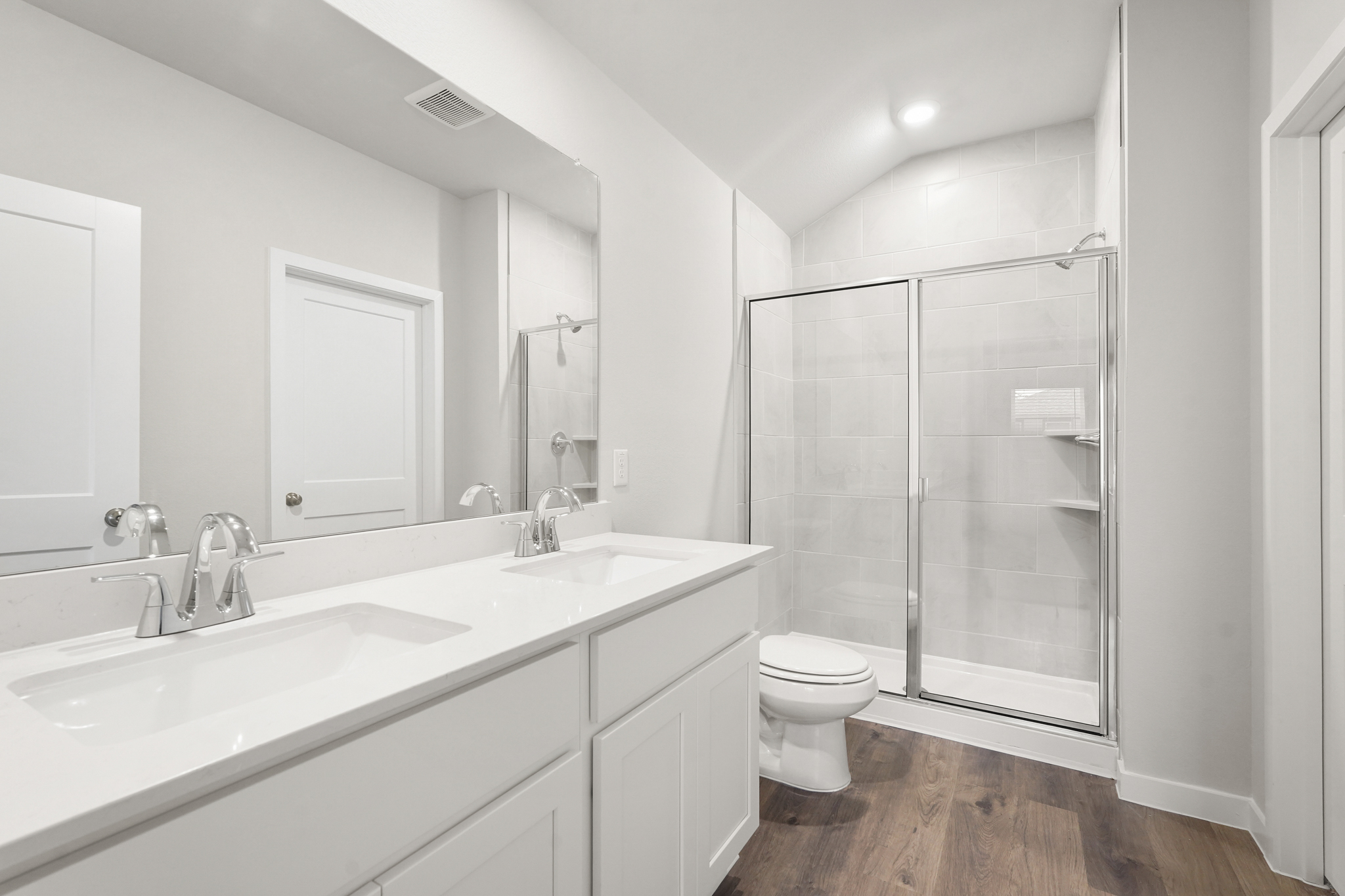 A bathroom with a glass shower.