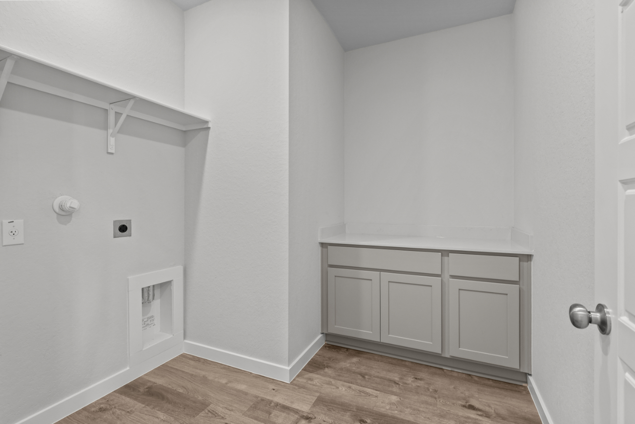 A white room with a white cabinet.
