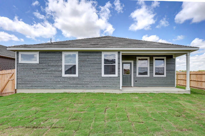 A house with a grass yard.