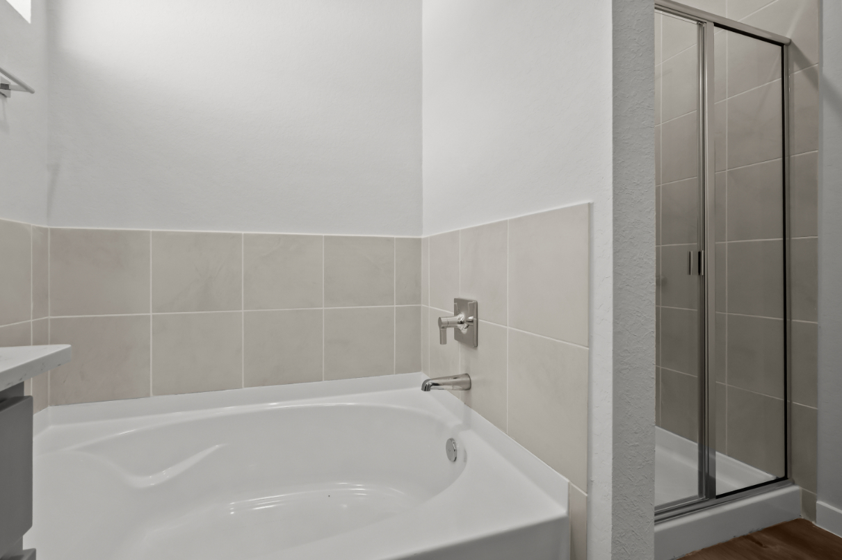 A bathtub in a bathroom.