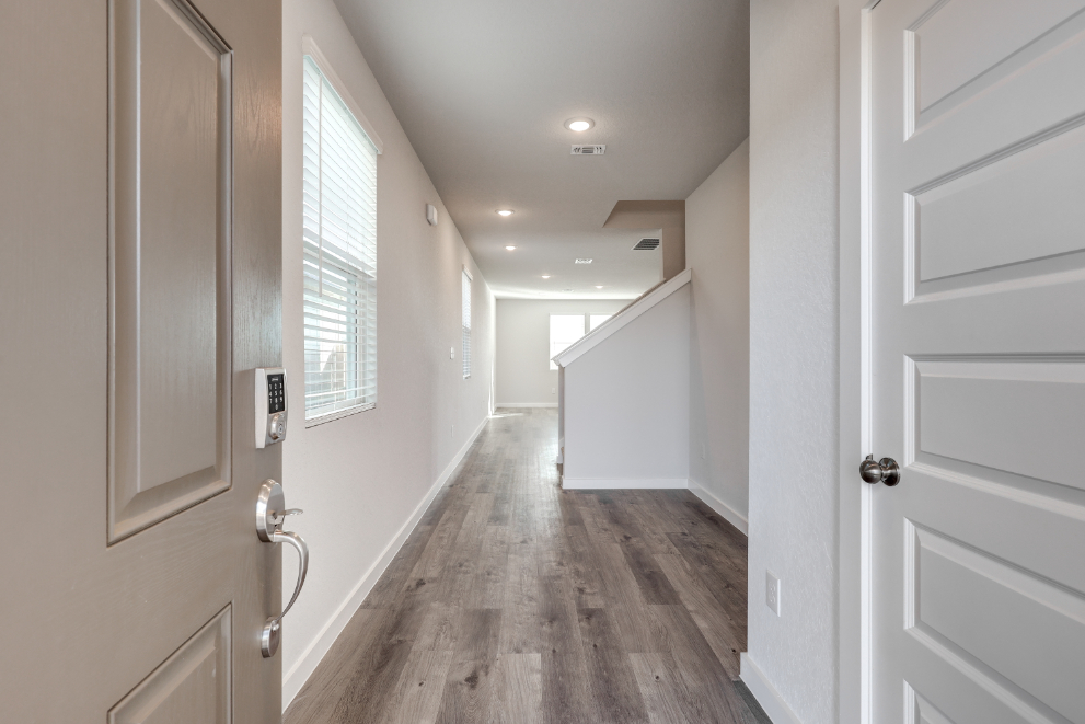 A hallway with white doors.