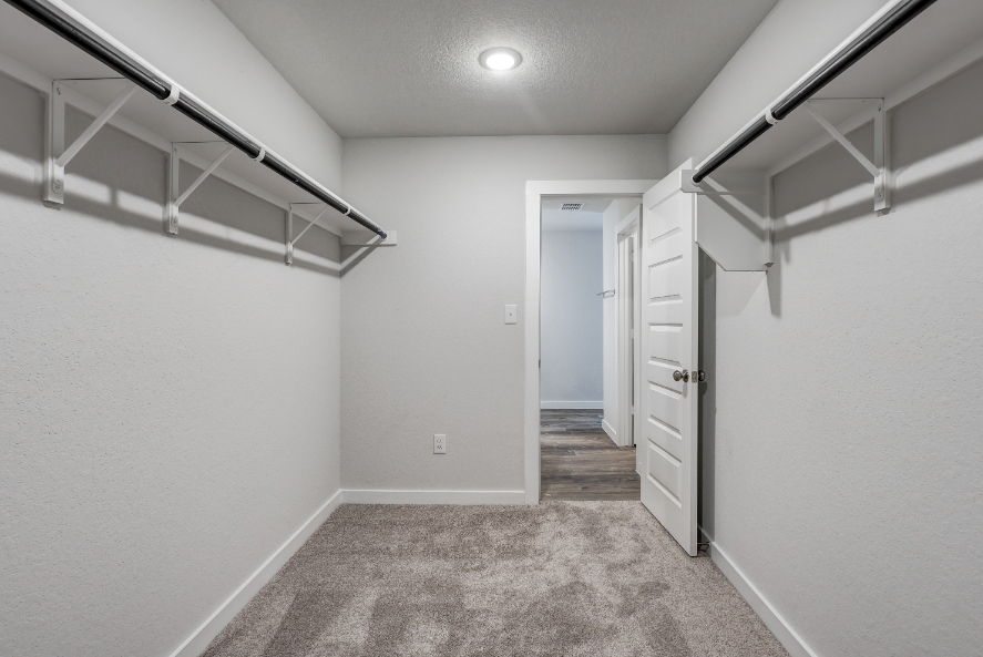 A hallway with white walls.