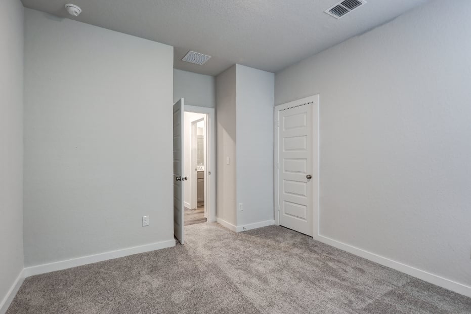 A hallway with white walls.