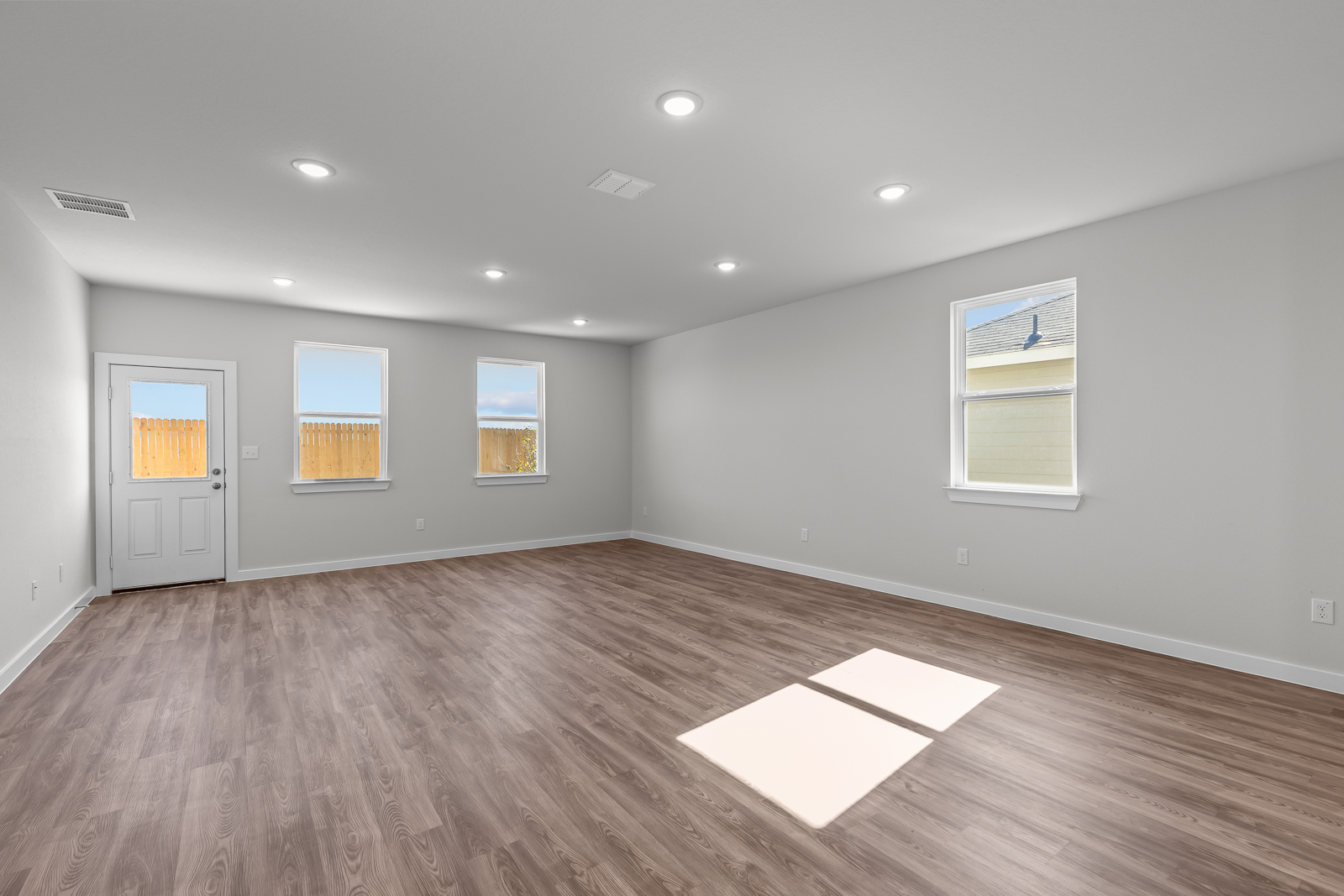 A room with a basketball hoop and a basketball in it.