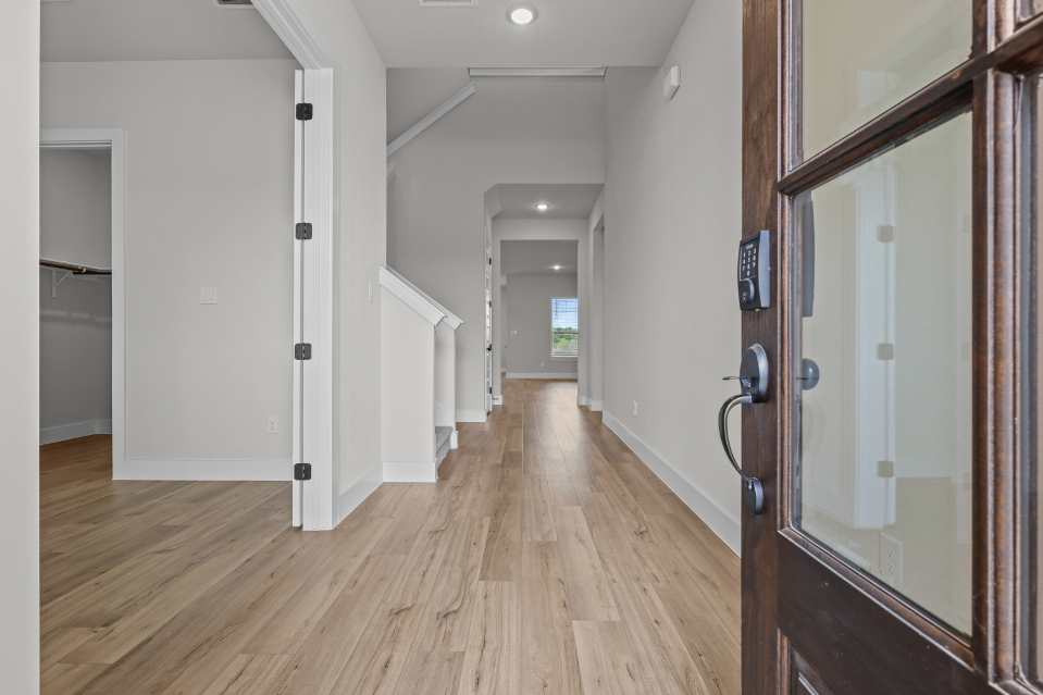 A hallway with white walls.