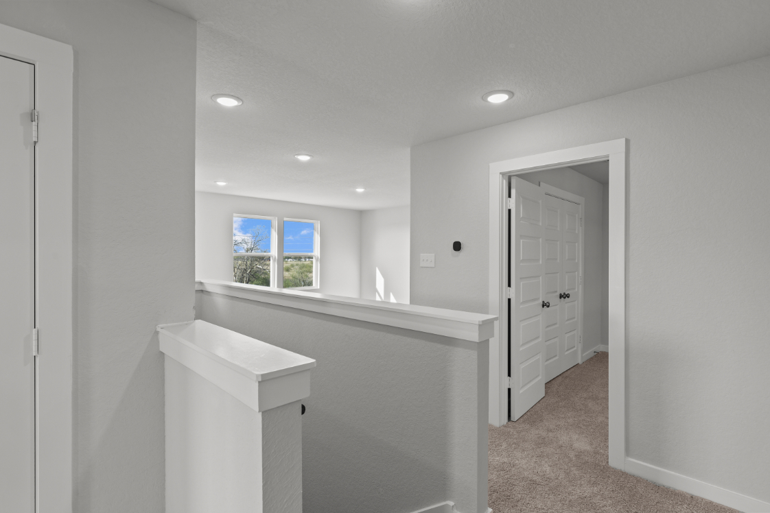 A bathroom with a sink and a window.