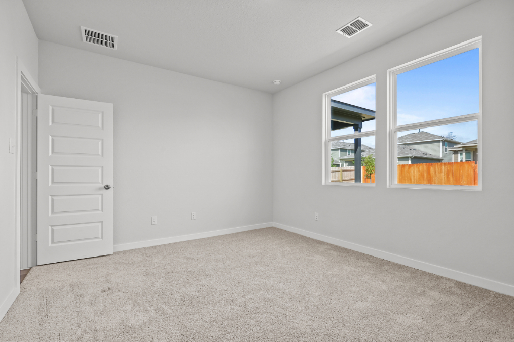 A room with a window and a door.