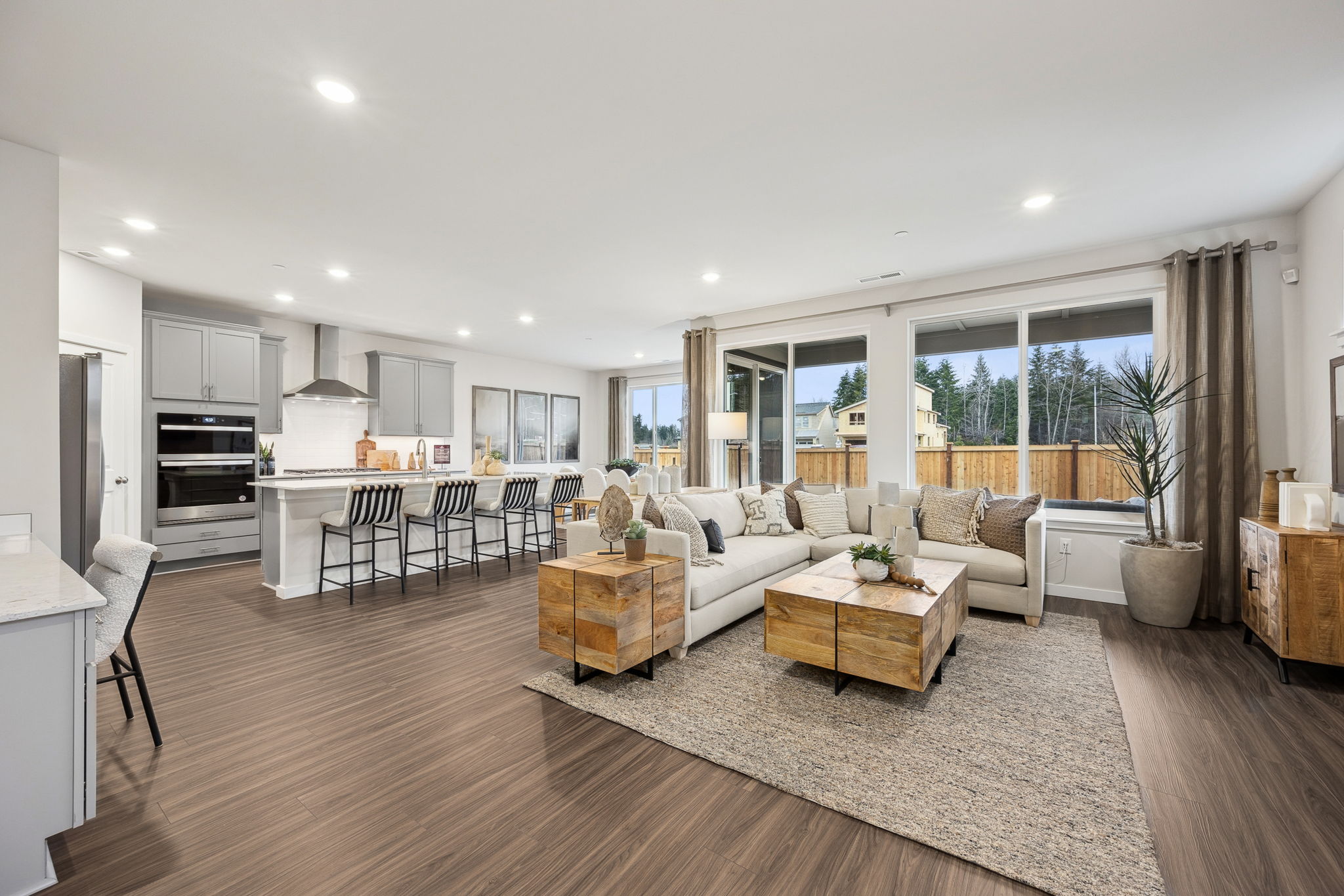 A large living room with a large kitchen and dining area.