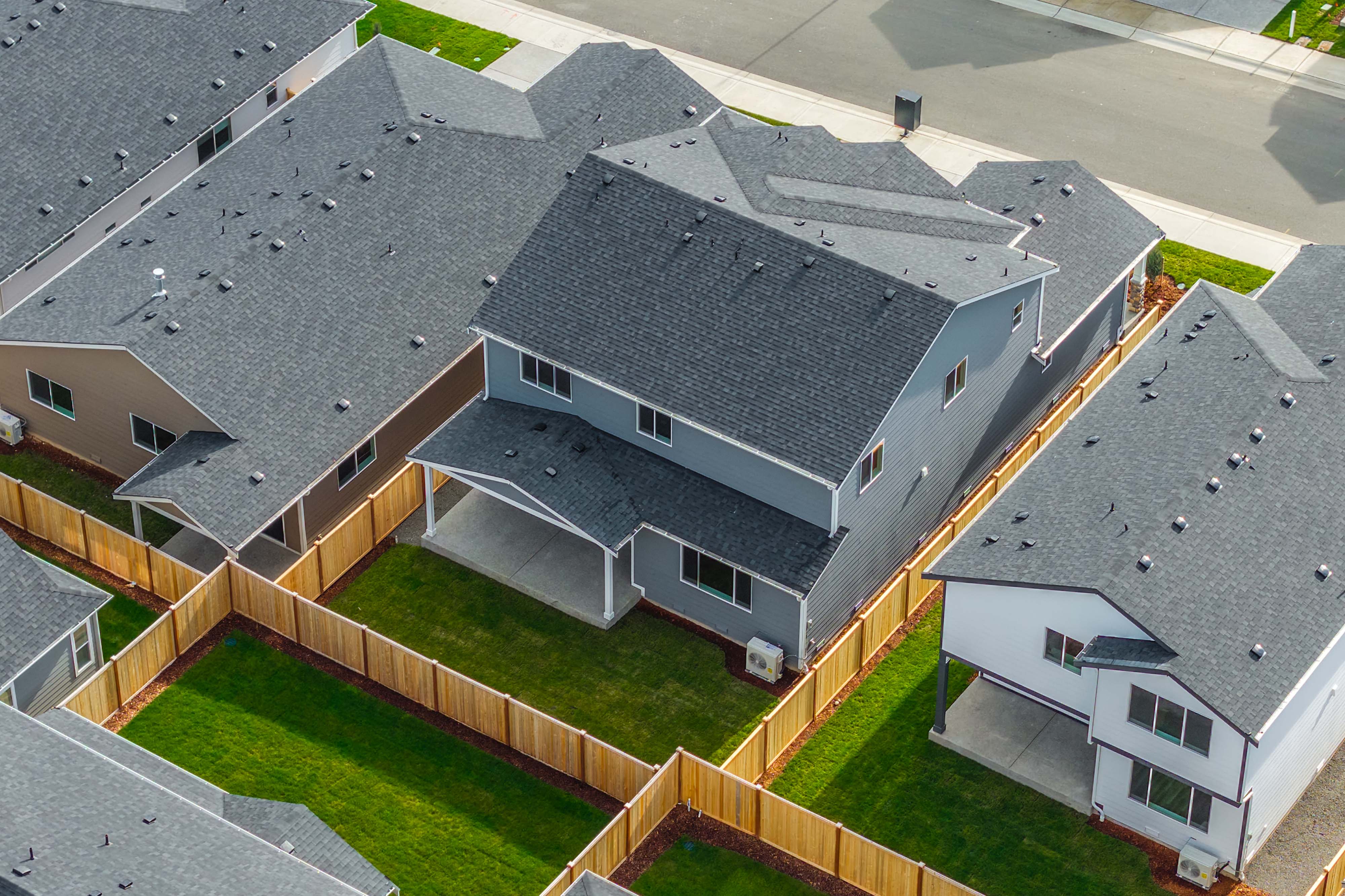 A building with a grass yard.